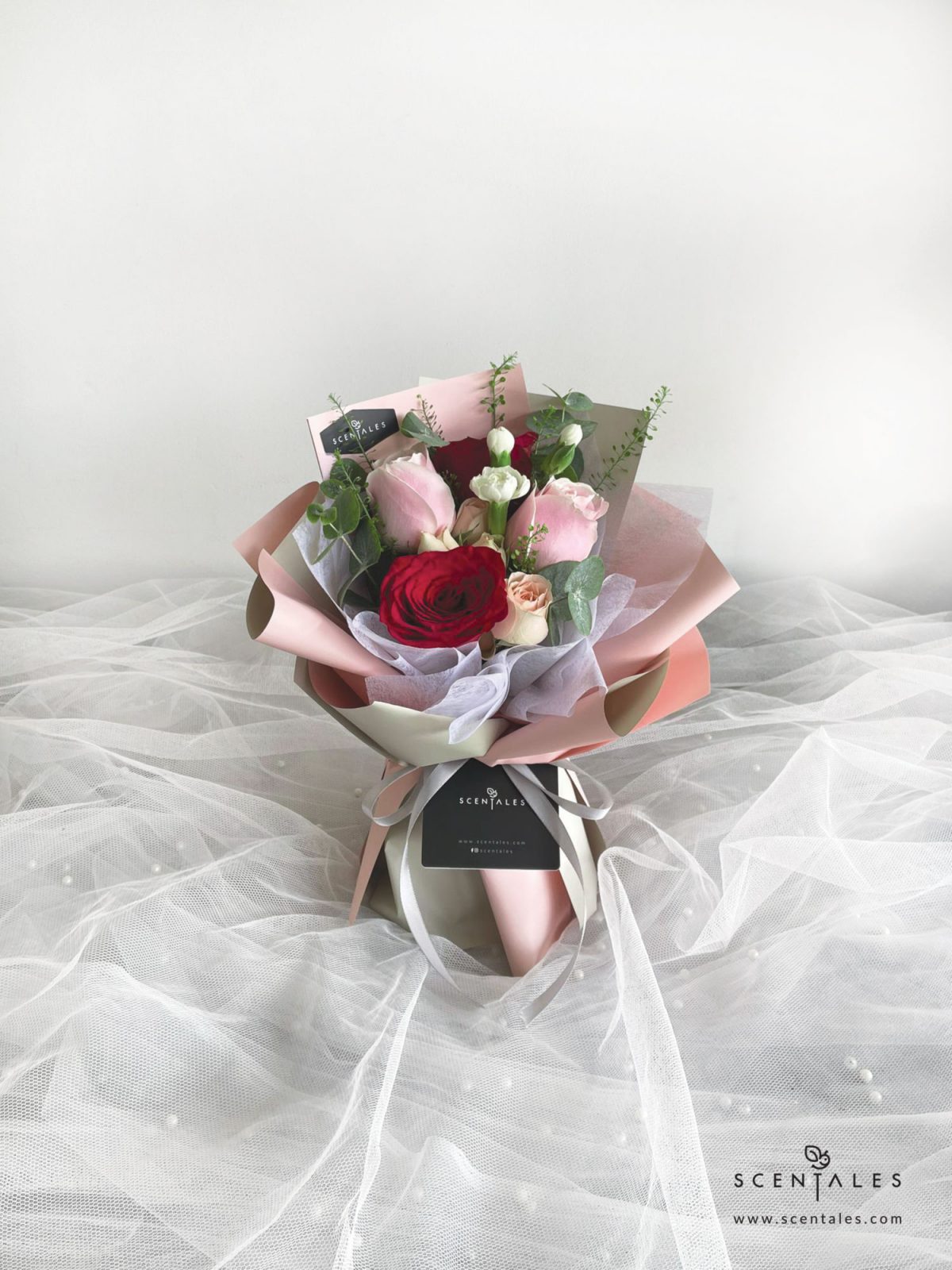 Fresh flower bouquet with Red rose, soft pink rose, champagne spray rose, white spray carnation, plenty of thlaspi and eucalyptus