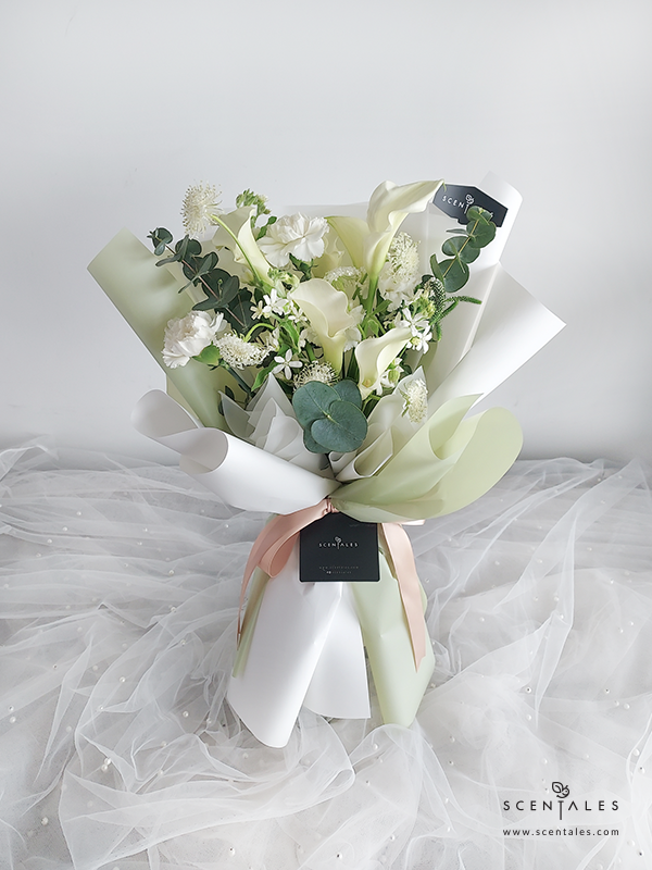 fresh flower bouquet with Calla lily, white carnation, white oxypetalum, trachymene, veronica and plenty of eucalyptus