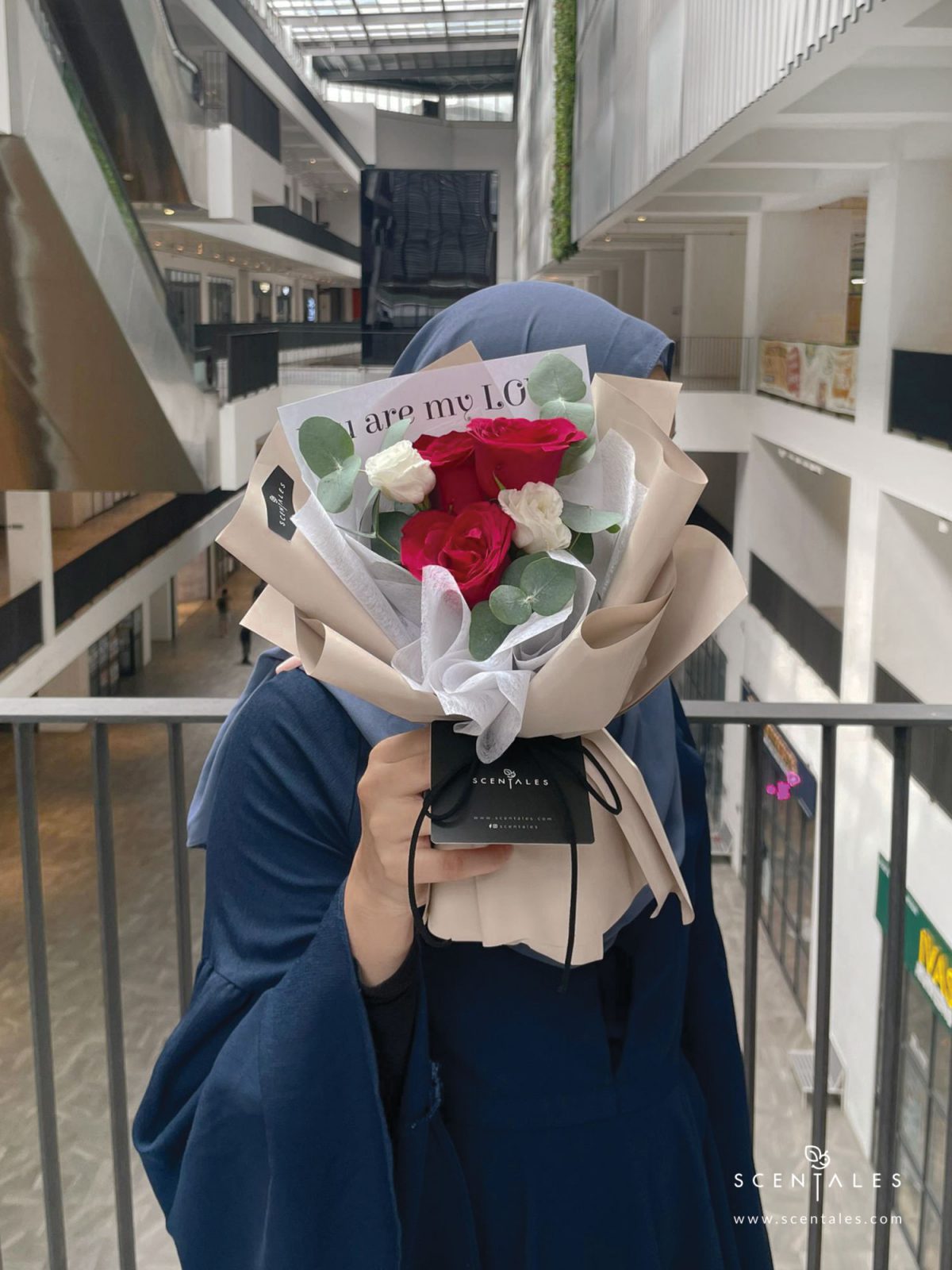 Fresh flower bouquet with red rose, white eustoma and plenty of eucalyptus