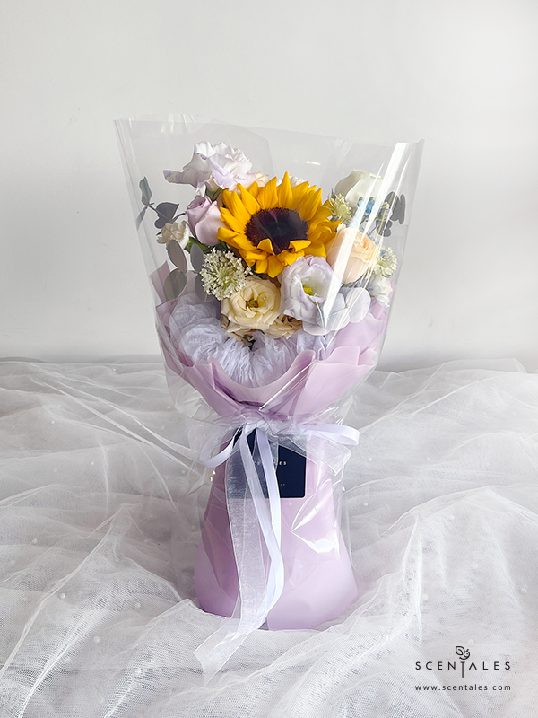 fresh flower bouquet with sunflower, white rose, champagne rose, champagne spray rose, lilac eustoma buds, white spray carnation, blue oxypetalum, trachymene buds and plenty of eucalyptus