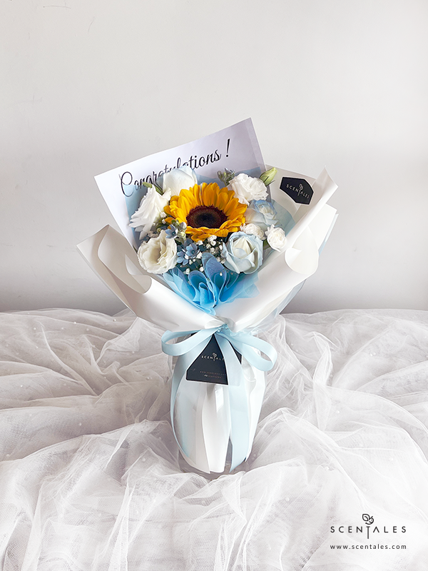 fresh flower bouquet with sunflower, blue rose, white eustoma, white spray carnation and blue oxypetalum