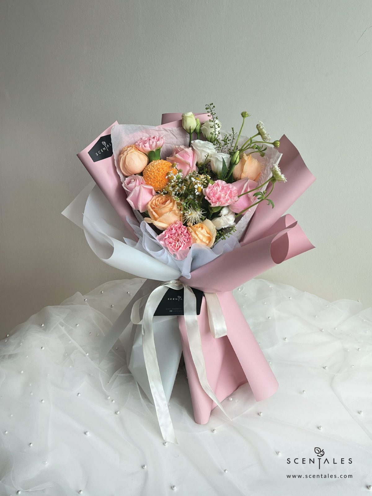 Fresh Flower Bouquet with Champagne rose, pink rose, pink carnation,ping pong, chamomile, white trachymene buds, white eustoma and plenty of thlaspi