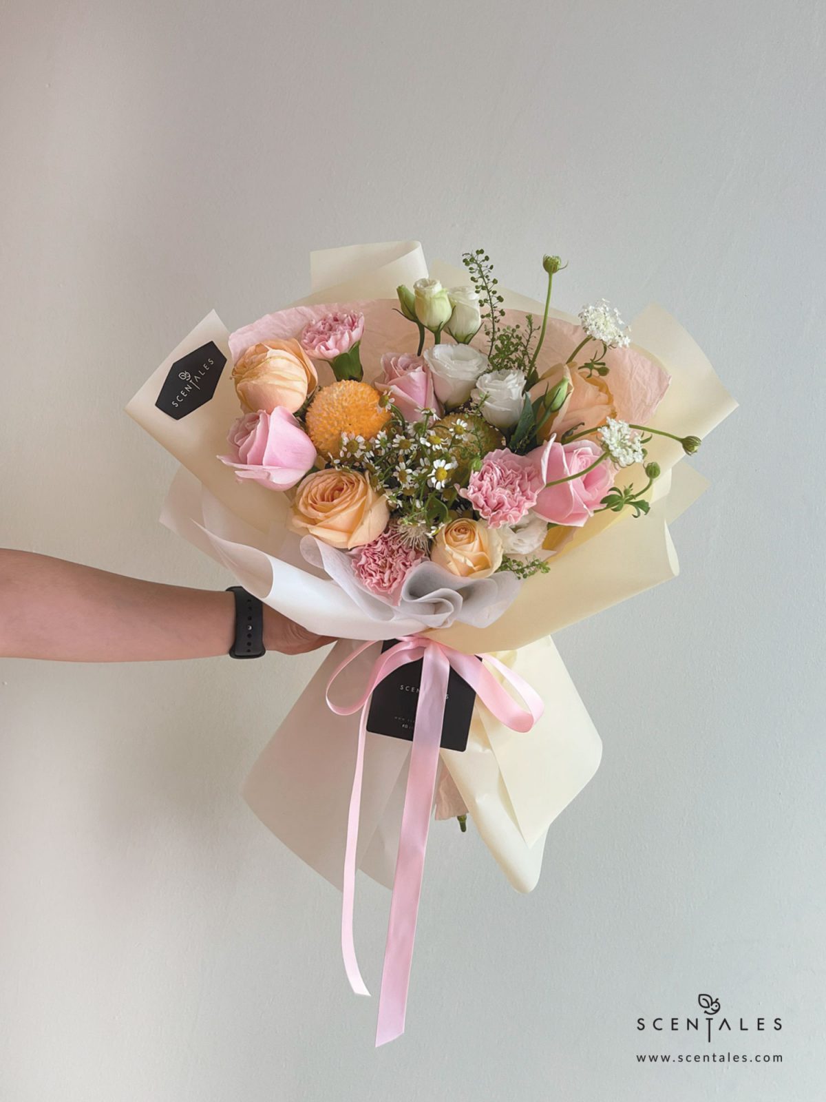 Fresh Flower bouquet with Champagne rose, pink rose, pink carnation, orange ping pong, chamomile, white trachymene buds, white eustoma and plenty of thlaspi