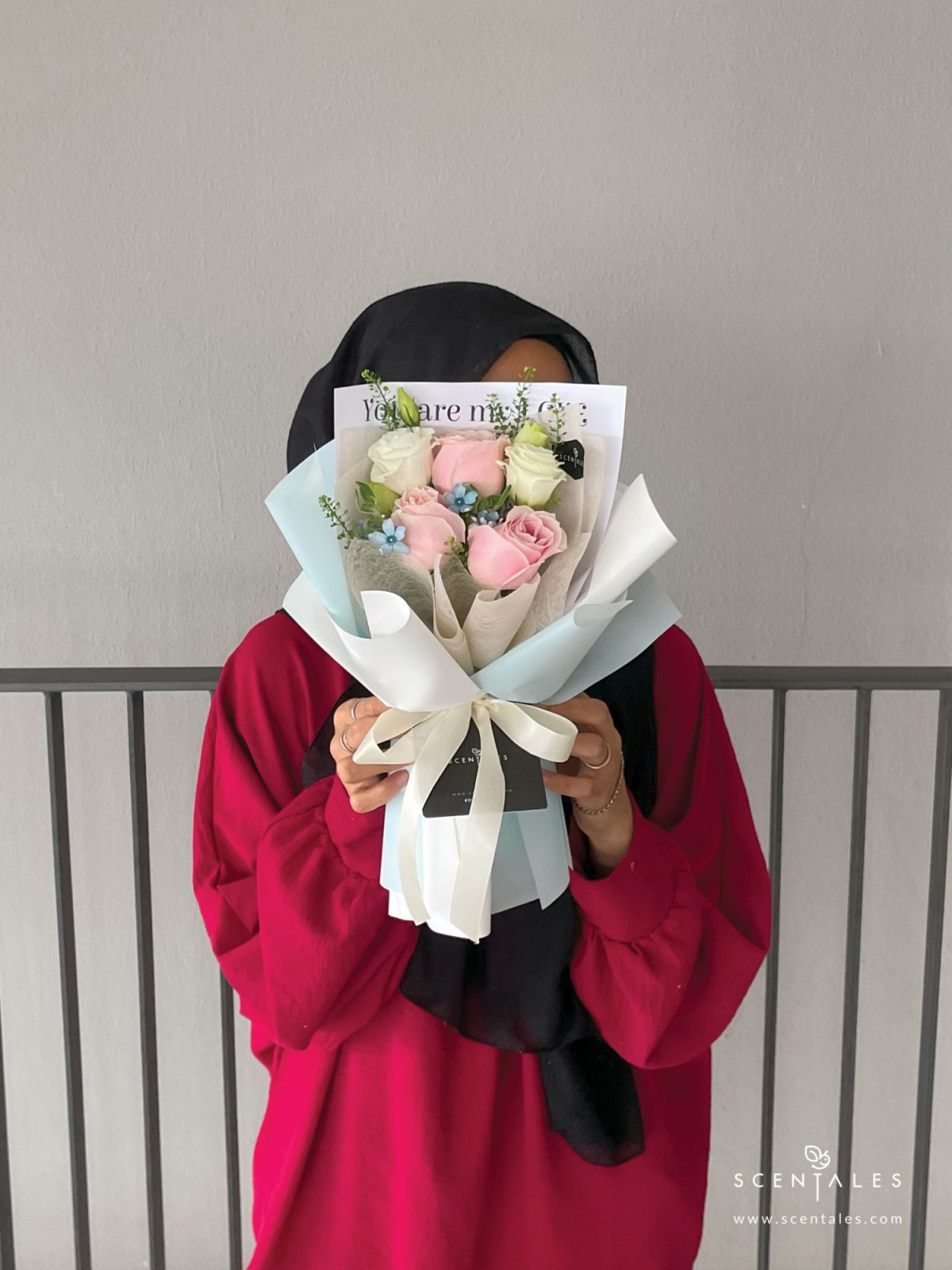 Fresh flower bouquet with Pink rose, white eustoma buds, blue oxypetalum and plenty of thlaspi