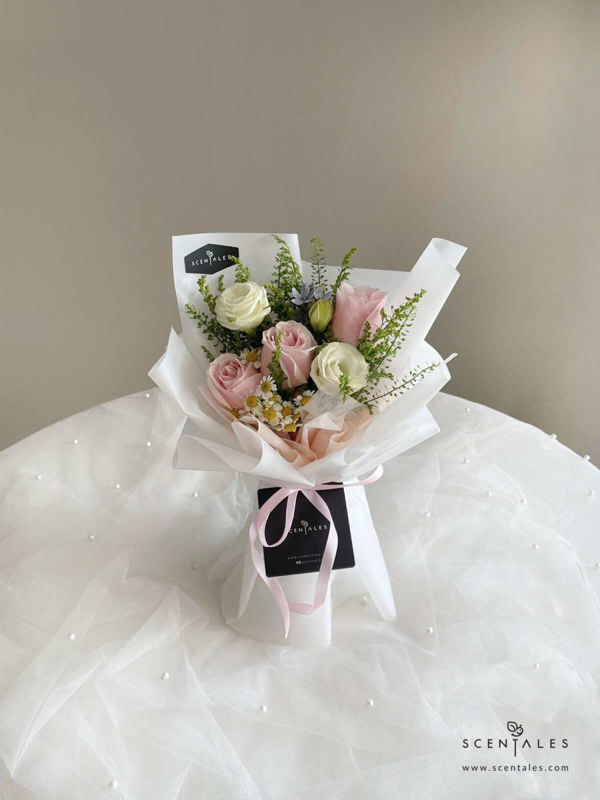 Fresh flower bouquet with Soft pink rose , champagne spray rose, white eustoma buds, blue oxypetalum, chamomile and plenty of thlaspi and yellow peacock