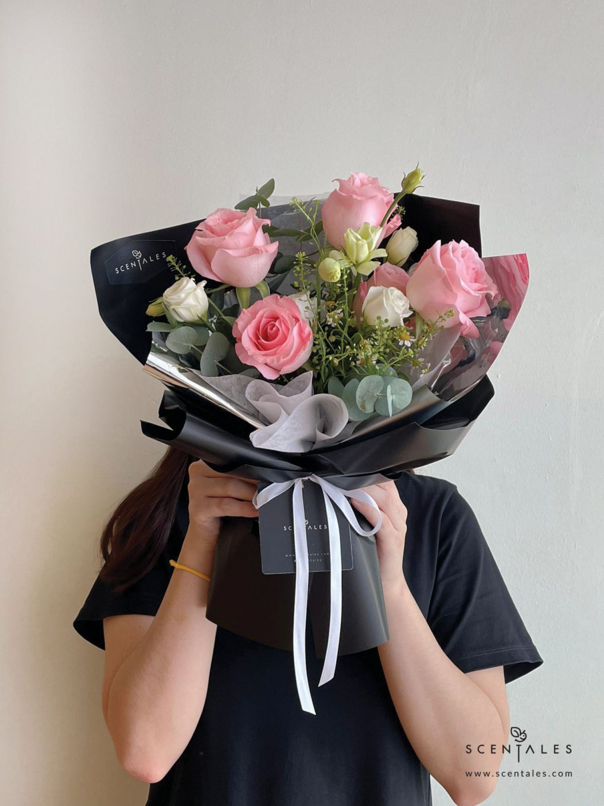 Fresh flower bouquet with Pink rose, white eustoma buds, chamomile, plenty of thlaspi and eucalyptus