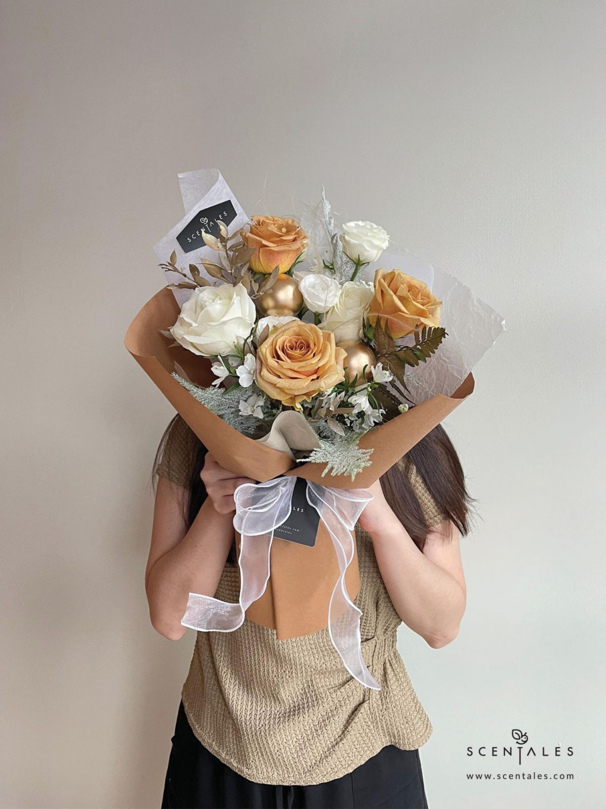 Fresh flower bouquet with Toffee rose, white rose, white eustoma buds, white mini delphinium, paku leaf, gold christmas ball and plenty of asparagus fern, stipa grass and preserved ruscus