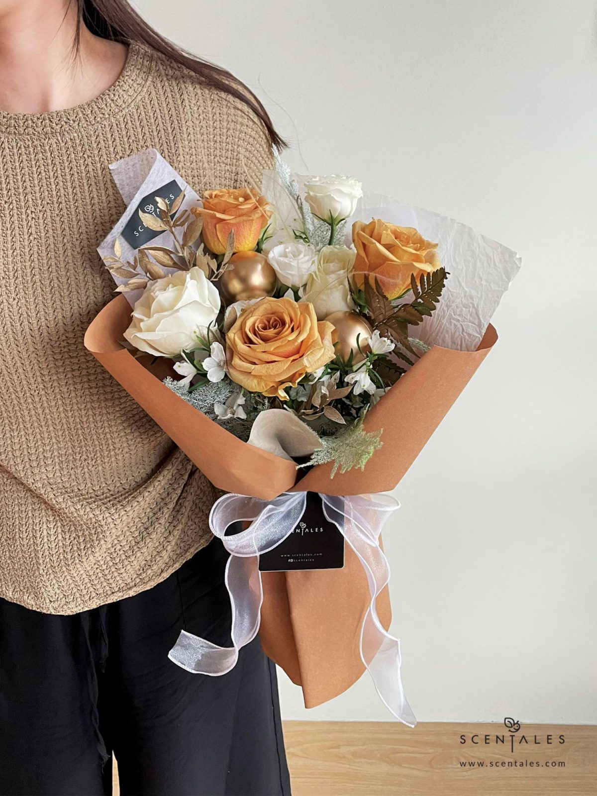 Fresh flower bouquet with Toffee rose, white rose, white eustoma buds, white mini delphinium, paku leaf, gold christmas ball and plenty of asparagus fern, stipa grass and preserved ruscus