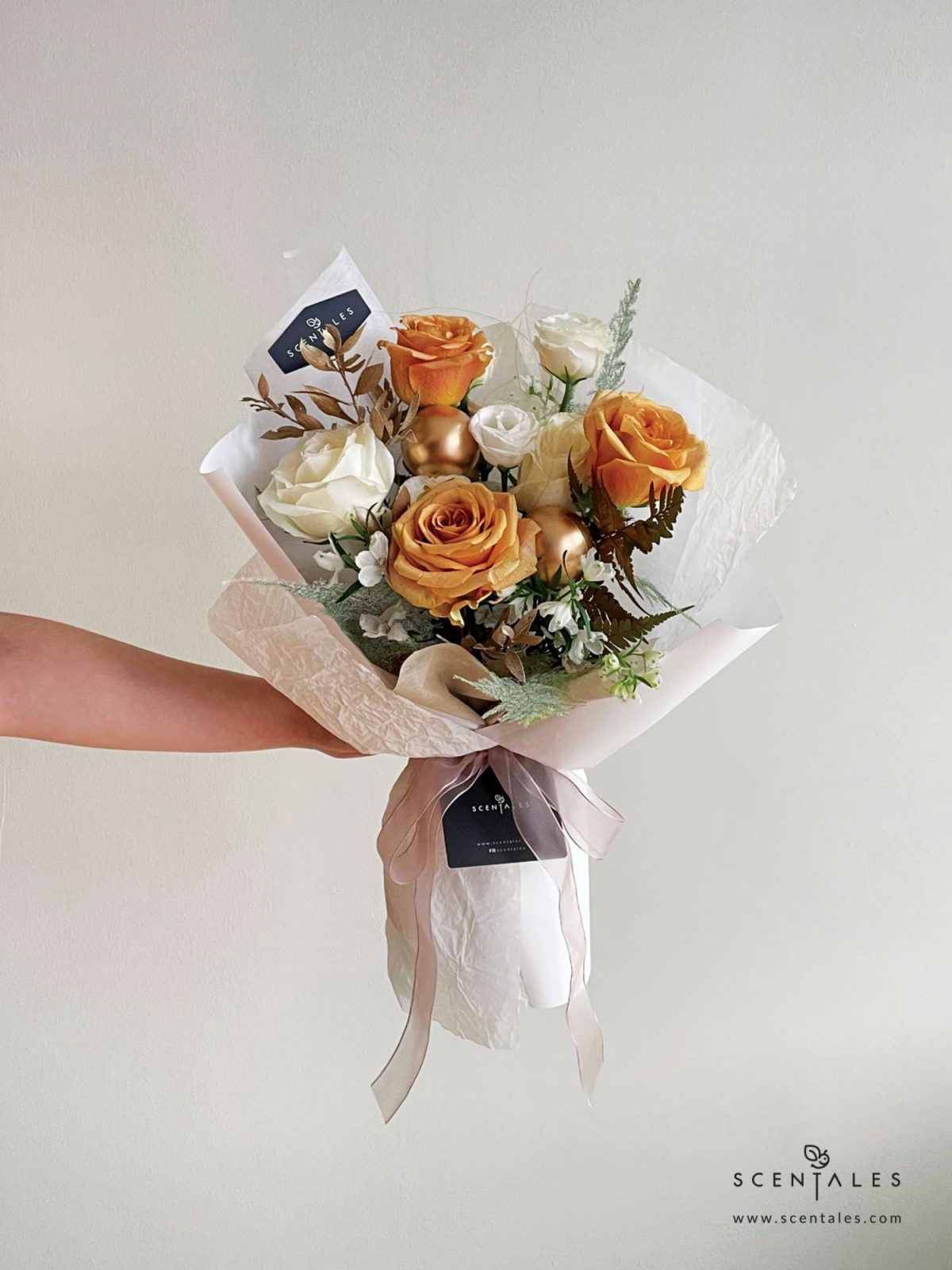 Fresh flower bouquet with Toffee rose, white rose, white eustoma buds, white mini delphinium, paku leaf, gold christmas ball and plenty of asparagus fern, stipa grass and preserved ruscus