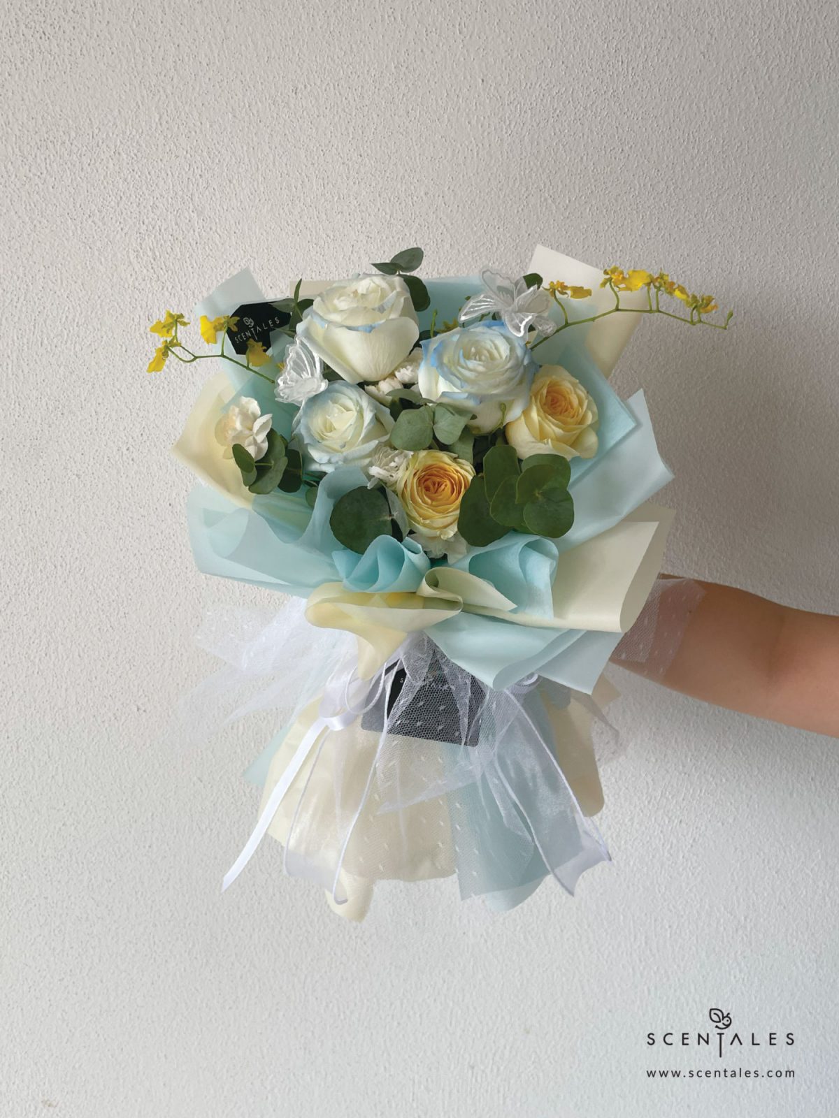 fresh flower bouquet with Gradient rose, cream rose, white spray carnation, yellow dancing lady, butterfly and plenty of eucalyptus cinerea