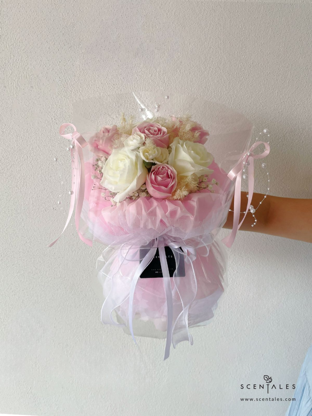 fresh flower bouquet with pink rose, white rose, white spray carnation, plenty of preserved white asparagus and white baby's breath