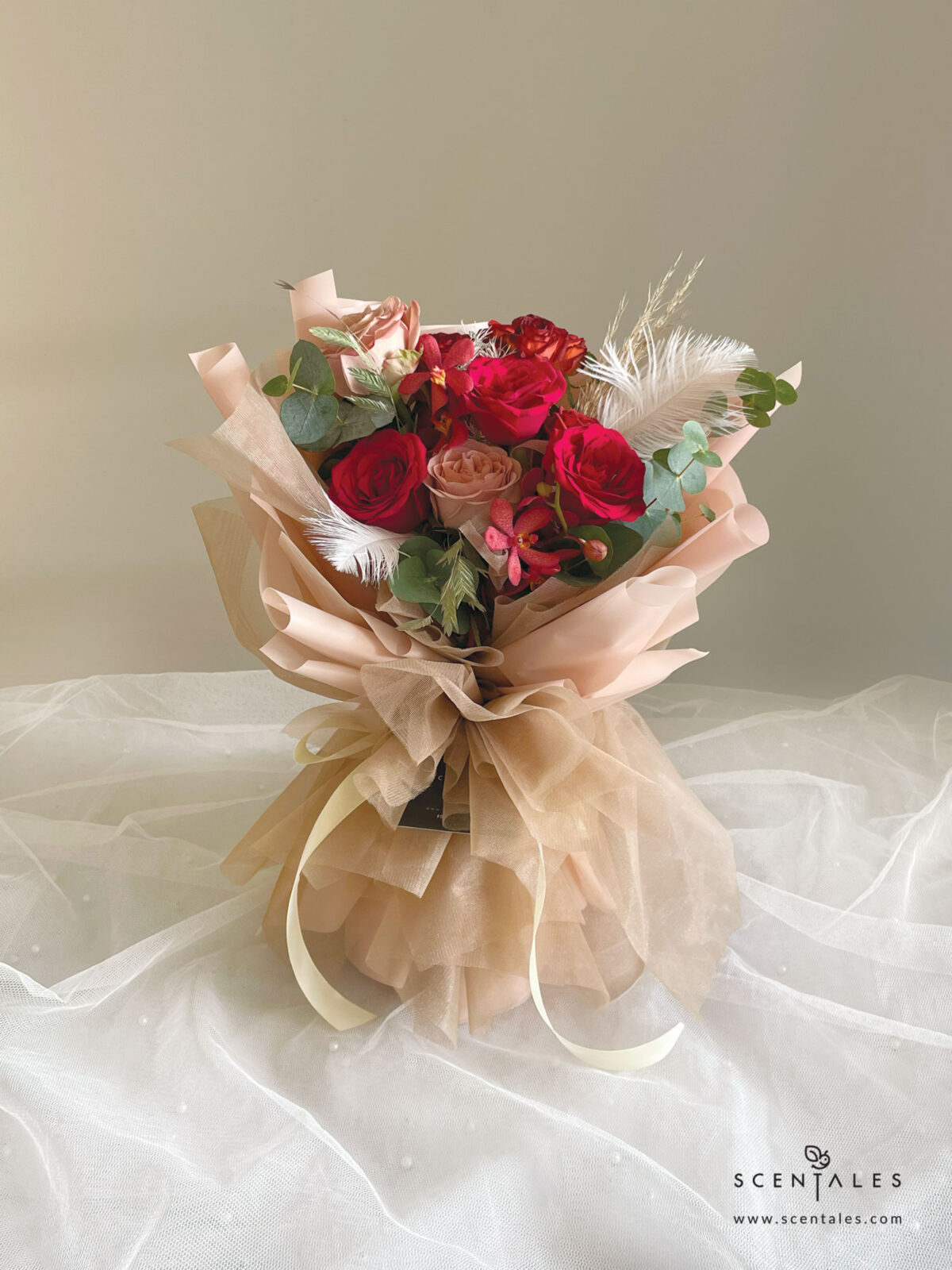 fresh flower bouquet with red rose, cappuccino rose, chocolate spray rose, dried brown pampas, red mokara orchid, preserved white asparagus, chasmanthium grass, white feather and plenty of eucalyptus cinerea