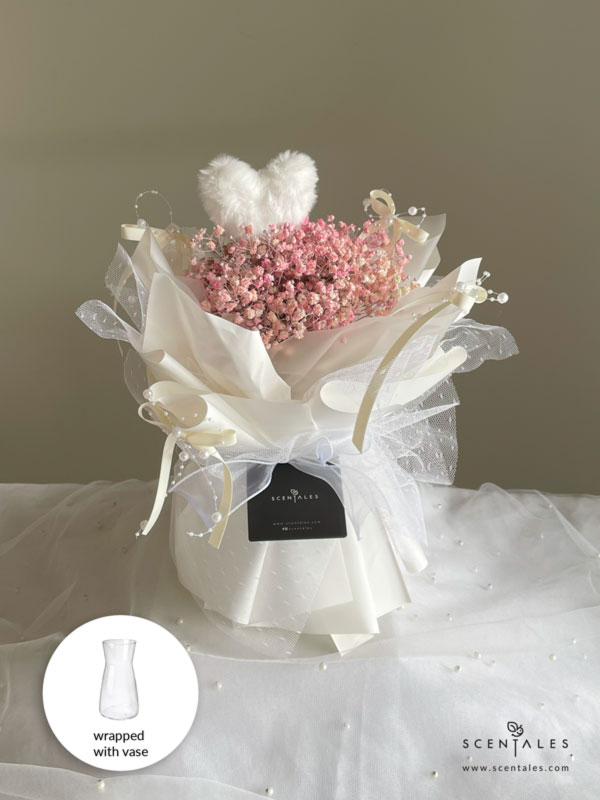 fresh flower bouquet with plenty of pink baby's breath and fluffy heart