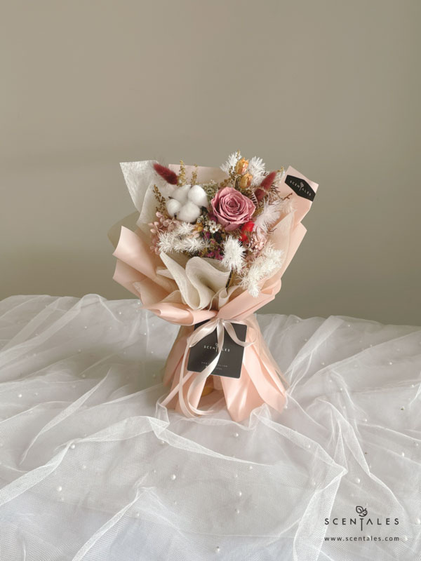 dried and preserved flower bouquet with preserved cappuccino rose, white cotton, red bunny tail, maroon bunny tail, yellow peacock, plenty of ixodia, preserved light brown hydrangea, dried fushia caspia, dried white caspia and preserved white asparagus