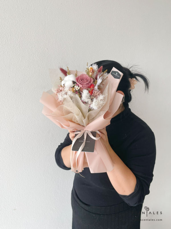 dried and preserved flower bouquet with preserved cappuccino rose, white cotton, red bunny tail, maroon bunny tail, yellow peacock, plenty of ixodia, preserved light brown hydrangea, dried fushia caspia, dried white caspia and preserved white asparagus