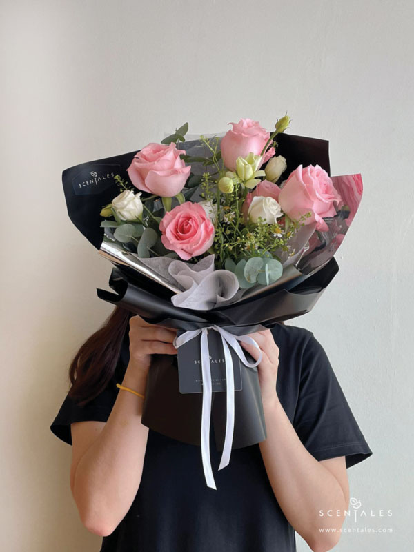 Fresh flower bouquet with Pink rose, white eustoma buds, chamomile, plenty of thlaspi and eucalyptus