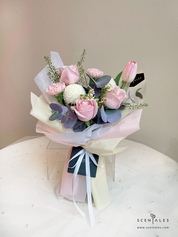 Fresh flower bouquet with Pink rose, pink carnation, pink tulip, ping pong, chamomile, plenty of thlaspi and eucalyptus