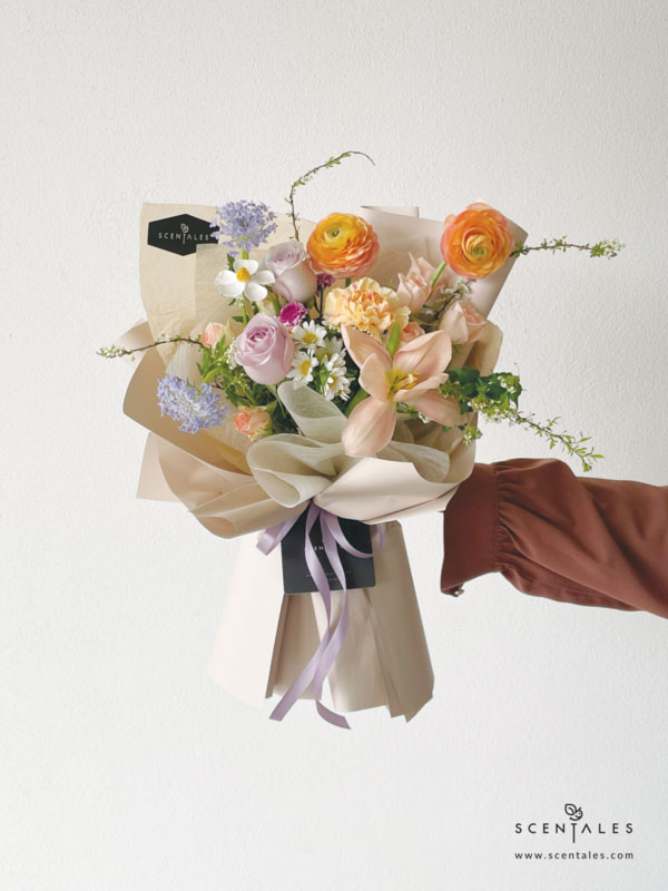 fresh flower with Apricot tulip, light orange ranunculus, champagne carnation, light orange spray rose, lilac rose, white hana, blue trachymene, light purple calimero, preserved white violet and plenty of spiraea