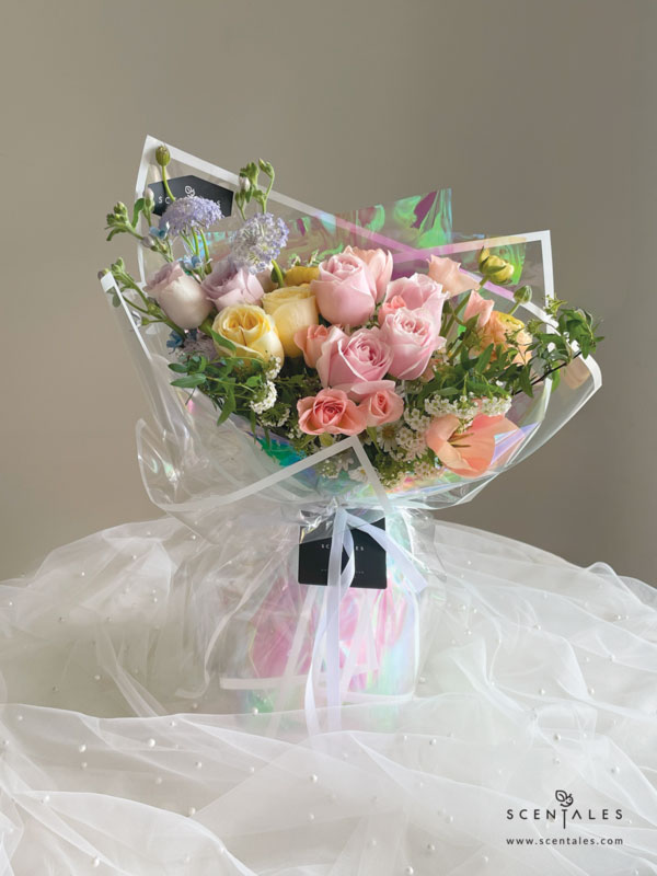 fresh flower with Apricot tulip, light orange ranunculus, cream rose, light orange spray rose, lilac rose, pink rose, white hana, blue trachymene, light purple calimero, chamomile, blue oxy and plenty of spiraea