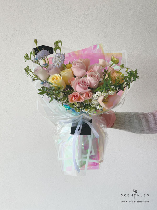 fresh flower with Apricot tulip, light orange ranunculus, cream rose, light orange spray rose, lilac rose, pink rose, white hana, blue trachymene, light purple calimero, chamomile, blue oxy and plenty of spiraea