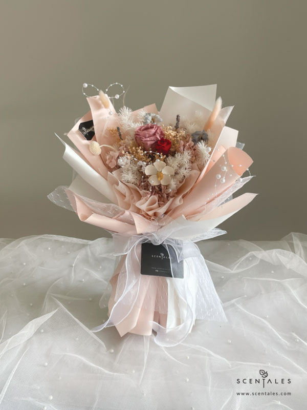 dried and preserved bouquet with preserved cappuccino rose, preserved red small rose, preserved white craspedia, lavendar , white violet flower , bunny tail, dried blue delphinium buds, plenty of preserved pink hydrangea, preserved light brown hydrangea, preserved white asparagus, dried baby breath and preserved broom