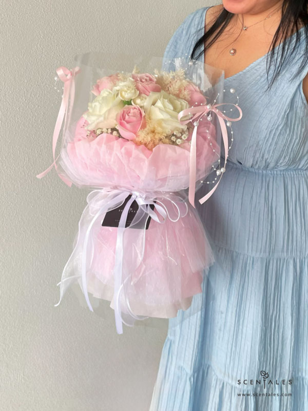 fresh flower bouquet with pink rose, white rose, white spray carnation, plenty of preserved white asparagus and white baby's breath