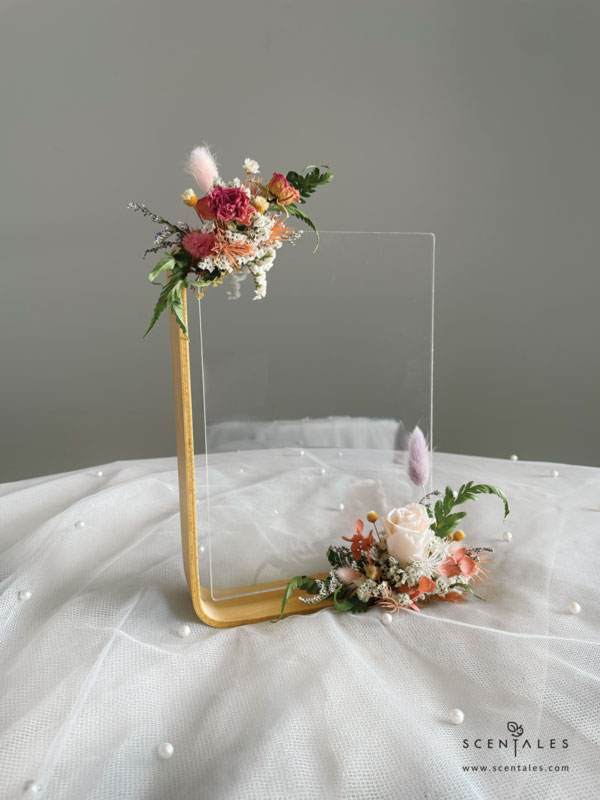 dried and preserved bouquet with preserved champagne small rose, purple bunny tail, pink bunny tail, dried pink spray rose buds, happy flower, a bit of preserved light brown hydrangea, preserved light brown asparagus, dried white caspia, dried blue caspia and dried paku leaves