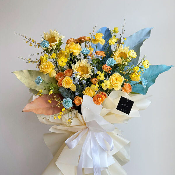 Citrus Sky Opening Flower Stand Opening Flower Stand with Cream sunflower , yellow rose , juice terrace rose spray , dyed carnation , sky blue mini delphinium , dancing lady , yellow ranunculus butterfly , tea leaf, jungle bush and plenty of eucalyptus