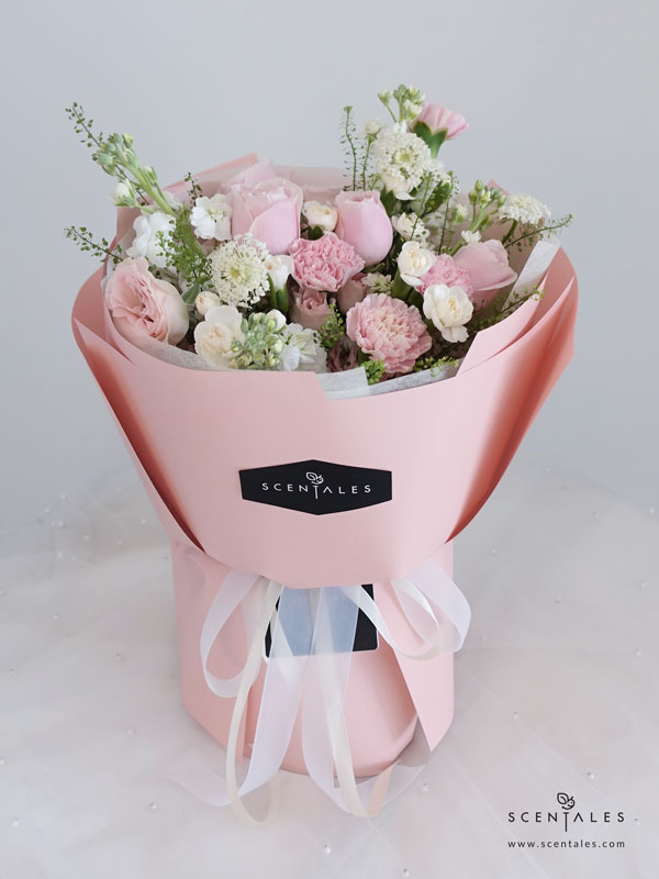 Fresh flower bouquet with Pink rose, pink spray rose, pink carnation, white spray carnation, white matthiola, trachymene and thlaspi