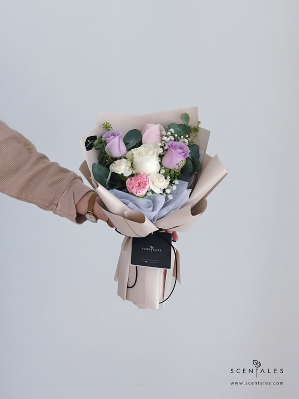 fresh flower bouquet with Lilac rose, soft pink rose, white rose, pink carnation, white spray carnation, plenty of baby’s breath, thlaspi and eucalyptus