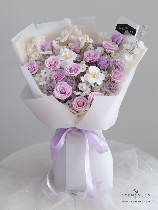 Floral Sonnet Soap Flower Bouquet Soap flower bouquet with soap lilac rose, soap light purple rose, soap grey purple small rose, soap purple carnation, soap lilac hydrangea, soap white tulip, soap white sakura, soap white small daisy, artificial white matthiola, white bunny tail and plenty of preserved white asparagus