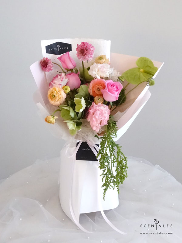 Muse de Lumière Flower Bouquet Fresh flower bouquet revival rose, apricot ranunculus, pink curly eustoma, green anthurium, pink scabiosa, green helleborus, pink rice flower, green tick and green amaranthus