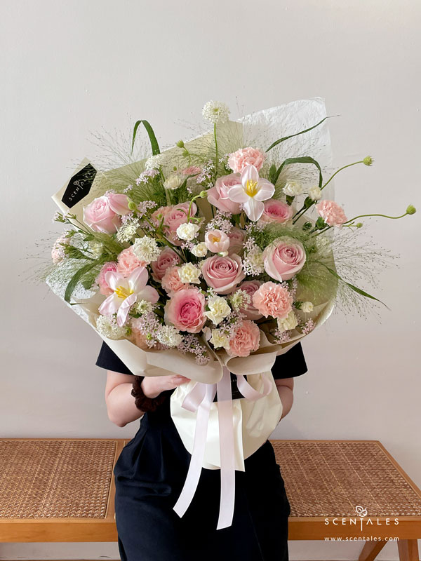 Her Gentle Way Flower Bouquet Fresh flower bouquet with Pink tulip, pink roselle rose, soft pink rose, pink carnation, white spray carnation, lilac saponaria, white trachymene, panicum