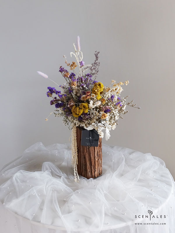 Amethyst Meadow Dried Flower Vase Dried flower vase with dried yellow celosia, dried matthiola, dried ranunculus butterfly, dried purple eustoma, dried white hana, dried yellow pompom, bunny tail, dried pink spray rose, dried pink rice flower, dried dusty miller, preserved white amaranthus, dried eucalyptus berry, dried trachymene, plenty of dried blue caspia, dried white caspia, dried white baby's breath, dried white statice, dried lilac statice and dried purple statice