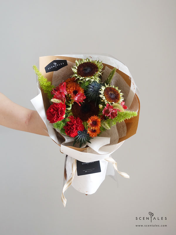 James Flower Bouquet Fresh flower bouquet with Sunflower, red alstroemeria, red carnation. blue eryngium, orange pompom, cat tail, fox tail and plenty of fish tail